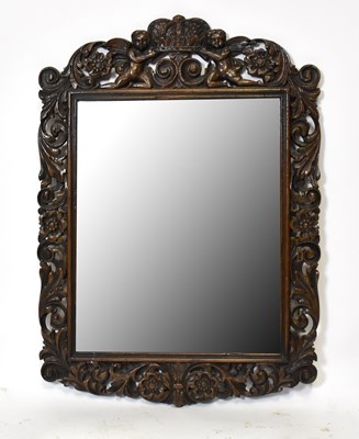 Lot 1685 - A Carolean style carved oak rectangular wall mirror