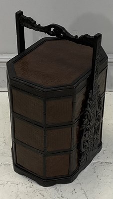 Lot 2057 - A Chinese carved and stained wood three...