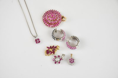 Lot 2191 - A white metal ruby set cluster pendant,...