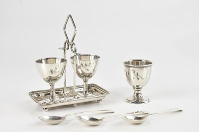 Lot 439 - A hallmarked silver egg cruet, with two egg...