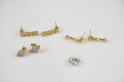 Lot 1399 - A pair of white metal diamond set ear studs,...