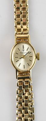 Lot 416 - TISSOT; a 9ct yellow gold lady's wristwatch,...
