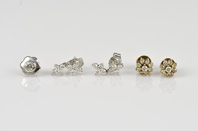 Lot 1407 - A pair of 18ct white gold diamond set ear...