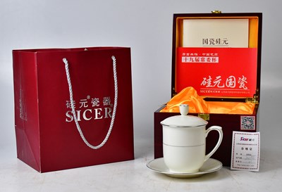 Lot 156 - A boxed Sicer Zhong Nanhai porcelain cup and...