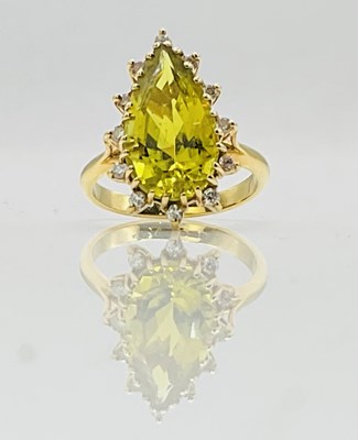 Lot 649 - An 18ct yellow gold diamond and gem set pear...