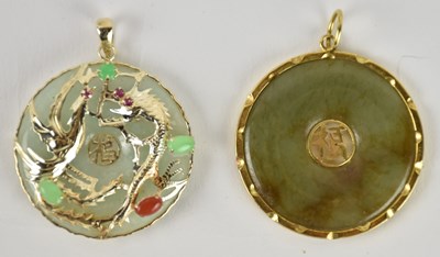 Lot 1347 - A 14ct yellow gold mounted jade bi disc...