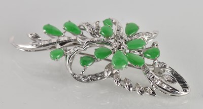 Lot 1430 - A white metal jade and diamond brooch...