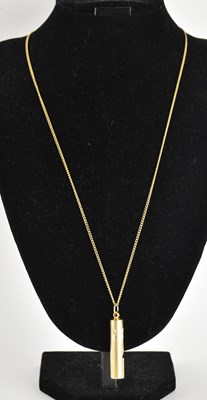 Lot 1361 - A vintage 1970s gold plated whistle pendant,...