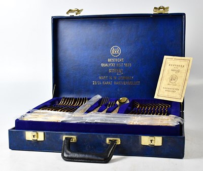 Lot 712 - A Solingen canteen of gold-plated cutlery for...