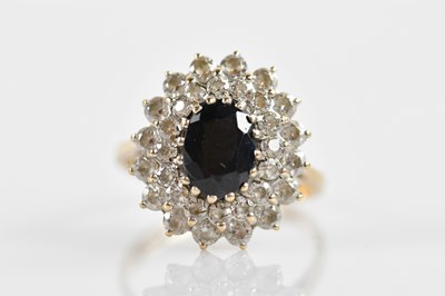 Lot 354 - A 9ct yellow gold cluster ring with central...