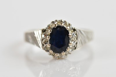 Lot 328 - An 18ct white gold and diamond ring with...