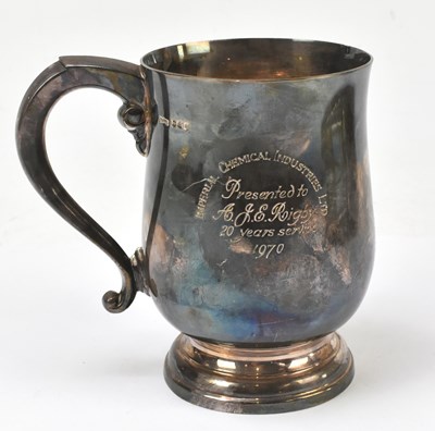 Lot 1094 - A hallmarked silver mug with presentation inscription