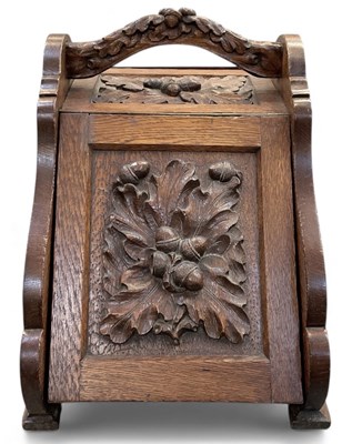 Lot 343 - An early 20th century carved oak coal scuttle,...