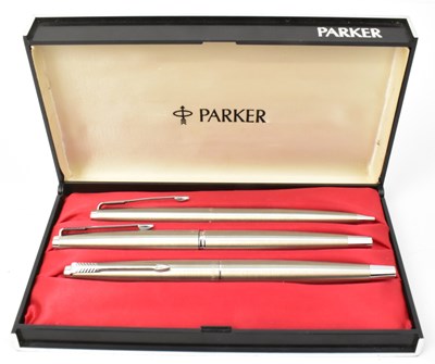 Lot 344 - PARKER; a stainless steel trio pencil set, in...