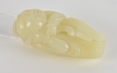 Lot 1005 - A Chinese carved white jade pendant of a...