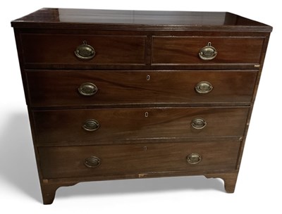 Lot 63 - An early 19th century mahogany chest of two...