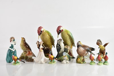 Lot 1119 - A collection of decorative models and figures...