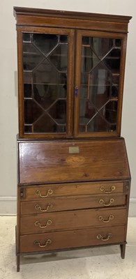 Lot 2065 - An Edwardian mahogany bureau bookcase, with...