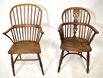 Lot 1680 - Two 19th century elm seated Windsor elbow chairs