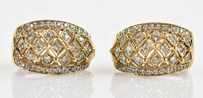 Lot 344 - A pair of 9ct yellow gold clip earrings,...