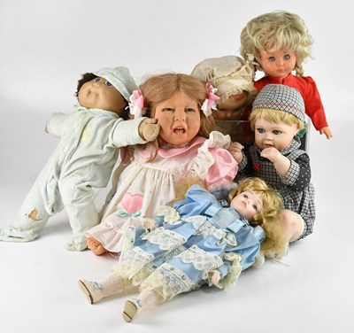 Lot 1588 - A collection of six dolls, including bisque...