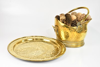 Lot 2320 - A circular brass charger with foliate...