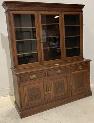 Lot 2024 - An Edwardian oak bookcase, with glazed doors...