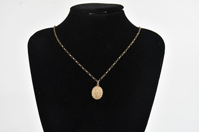 Lot 394 - A 9ct yellow gold St Christopher pendant,...