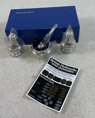 Lot 634 - An Elizabeth II hallmarked silver cased cruet,...