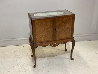 Lot 83 - EPSTEIN; a walnut cocktail cabinet, height...