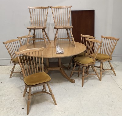 Lot 2036 - A modern light oak extending dining table,...