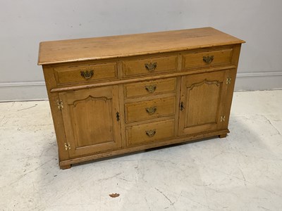 Lot 2088 - A modern light oak dresser base, with six...