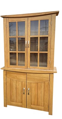 Lot 60 - A modern light oak bookcase, with a pair of...