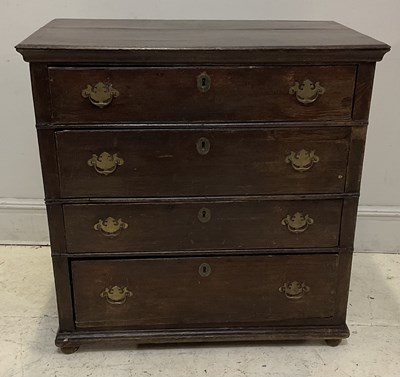 Lot 17 - A 19th century oak chest of four long drawers,...