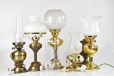 Lot 2333 - A collection of seven brass oil lamps / oil...