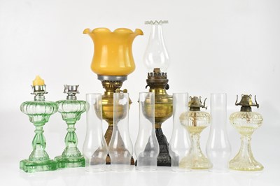 Lot 2334 - Two pairs of moulded glass oil lamps, and two...