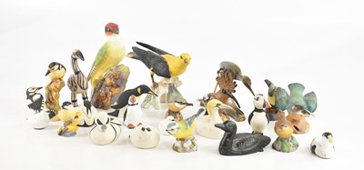 Lot 1334 - A large collection of model birds including a...