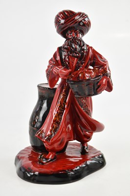 Lot 1311 - ROYAL DOULTON; a flambé 'The Lamp Seller',...