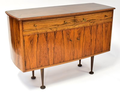 Lot 11 - A J MILNE; a mid-century rosewood sideboard of...