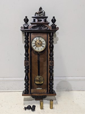 Lot 209 - A 19th century Vienna style wall clock, the...