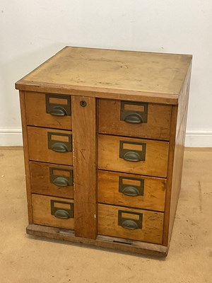 Lot 271 - A bank of eight drawers, with central locking...