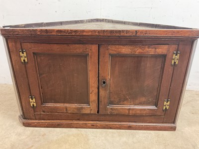 Lot 712 - An oak corner cupboard, height 72, width 182cm,...