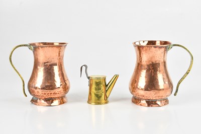 Lot 1298 - A pair of copper cups with brass handles,...