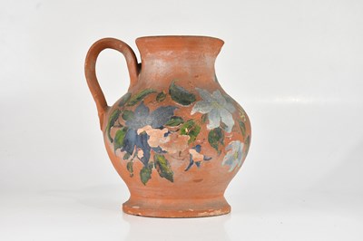 Lot 1038 - A late 19th century terracotta jug with...