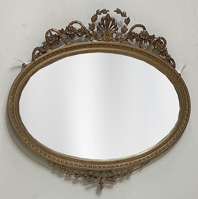 Lot 89 - An early 20th century gilt framed oval mirror,...