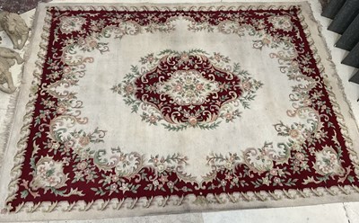 Lot 186 - A large Indian rug with stylised floral...