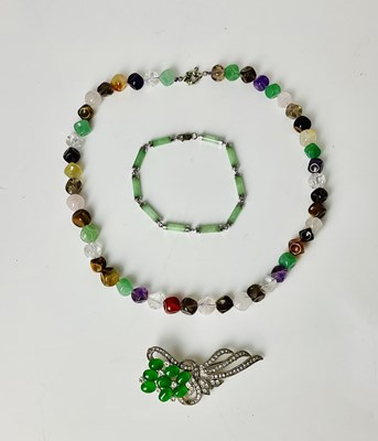 Lot 209 - A Chinese jadeite and silver mounted bracelet...
