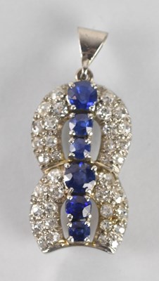 Lot 1324 - An Art Deco style white metal sapphire and...