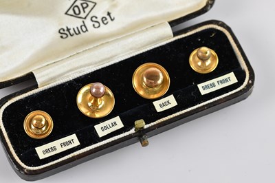 Lot 372 - REISS; a cased 9ct yellow set of four studs,...