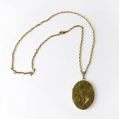 Lot 1025 - A 9ct yellow gold rolo link chain suspending a...